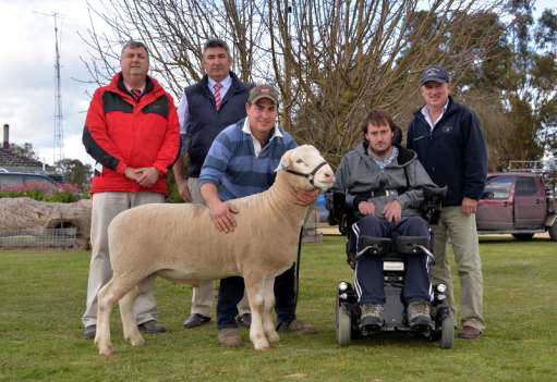 Bundara Downs co-principal Greg Funke holds the impressive $3400 top priced White Suffolk ram at their 20th annual on-property production sale. Also pictured are Elders Bordertown manager Brenton Henriks, SAL manager Laryn Gogel, Naracoorte, purchaser Stuart Staude, Riddick stud, Bordertown and his buying agent Kym Lovelock, Spence, Dix & Co, Bordertown.